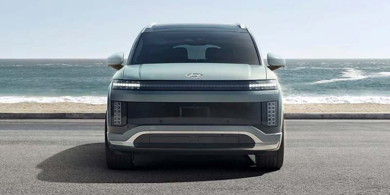 View of the rear of a 2022 Hyundai Santa Cruz with a mountain bike sticking out the back.